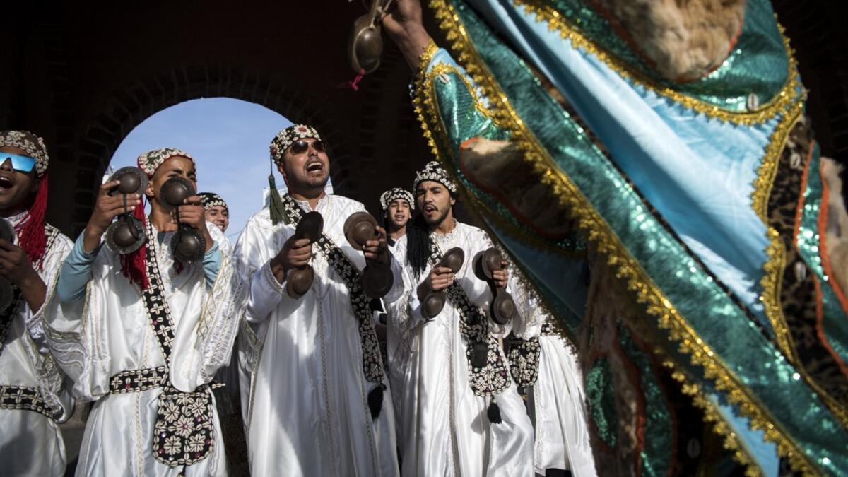 Gnawa refers to a "set of musical productions, fraternal practices and therapeutic rituals where the secular mixes with the sacred", according to the nomination submitted by Morocco. Often dressed in colourful outfits, Gnawa musicians play the guenbri, a type of lute with three strings, accompanied by steel castanets called krakebs. FADEL SENNA / AFP