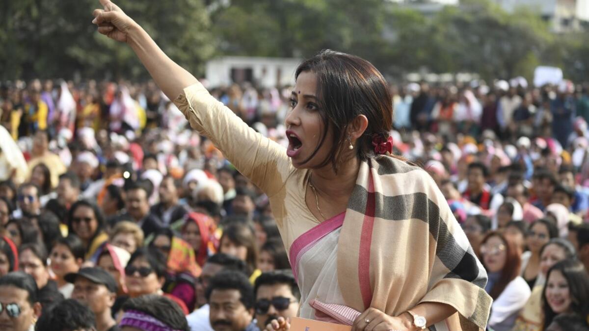 A woman shouts as she takes part in a musical concert along with others to protest against the Indian government's Citizenship Amendment Bill (CAB) in Guwahati on December 15, 2019. Sajjad HUSSAIN / AFP