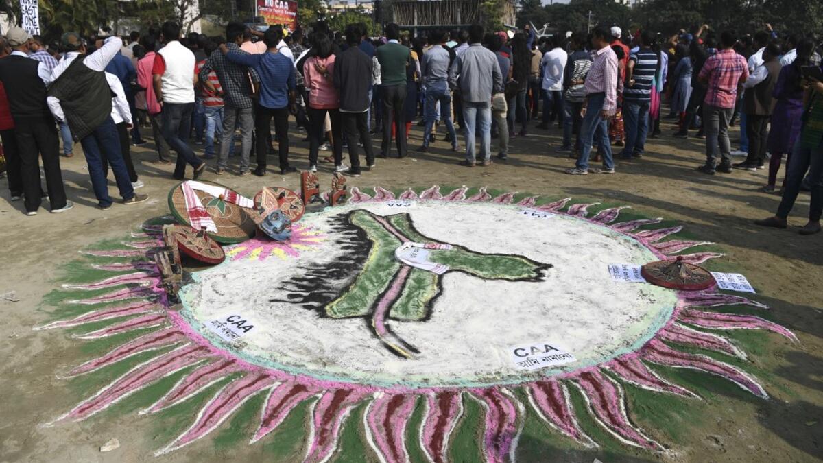 A traditional painting is pictured at a musical concert to protest against the Indian government's Citizenship Amendment Bill (CAB) in Guwahati on December 15, 2019. Some 5,000 people took part in a fresh demonstration in Guwahati on December 15, with hundreds of police watching on as they sang, chanted and carried banners with the words "long live Assam". SAJJAD HUSSAIN / AFP
