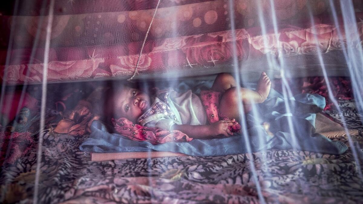 A displaced baby, who was forced to leave his house with his family due to heavy rains and floods in the area, rests under a mosquito net at a displacement camp for families affected by floods located in Beledweyne, Somalia, on December 14, 2019. The rains have inundated big areas surrounding Beledweyne area forcing thousands of people to leave their houses and look for humanitarian assistance while living in displacement camps. Due to climate change and human activities, floods have become more recurrent a