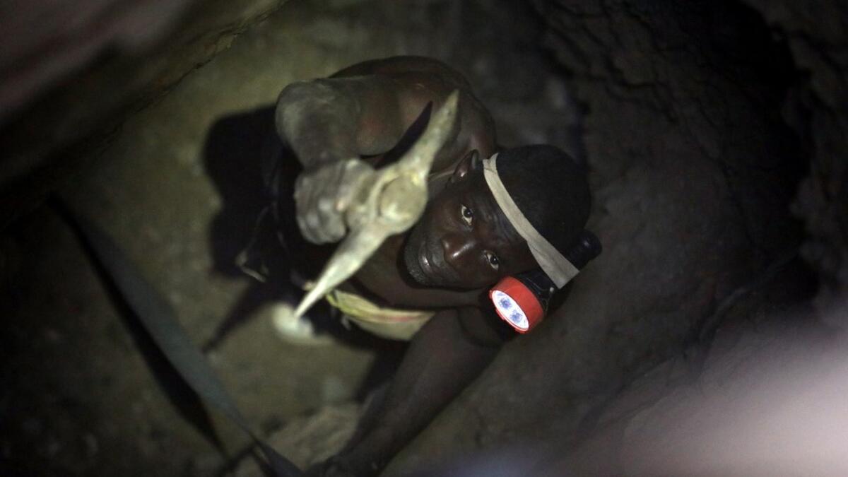 A gold miner works underground in Anka near Gusau, on December 4,2019. For generations, the mineral-rich earth of Nigeria's Zamfara state has provided families living here with a way to make ends meet. But in recent years their trade has become increasingly unsafe. The mines lie within the reach of heavily-armed groups -- dubbed "bandits" by the local authorities -- that have been terrorising this remote region.  Kola Sulaimon / AFP
