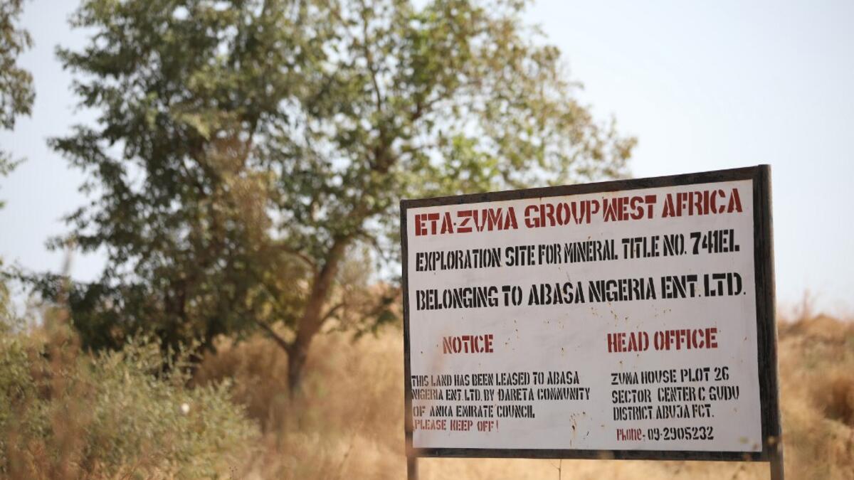 A signpost is seen at a mining site in Anka near Gusau, on December 4,2019. For generations, the mineral-rich earth of Nigeria's Zamfara state has provided families living here with a way to make ends meet. Kola Sulaimon / AFP