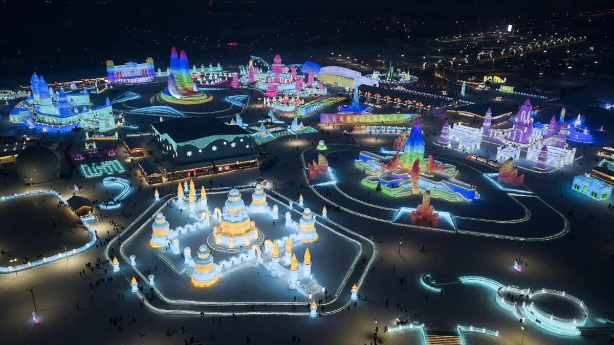 An aerial view shows ice sculptures illuminated ahead of the opening of the Harbin International Ice and Snow Festival in Harbin, in China's northeast Heilongjiang province on January 3, 2020. NOEL CELIS / AFP