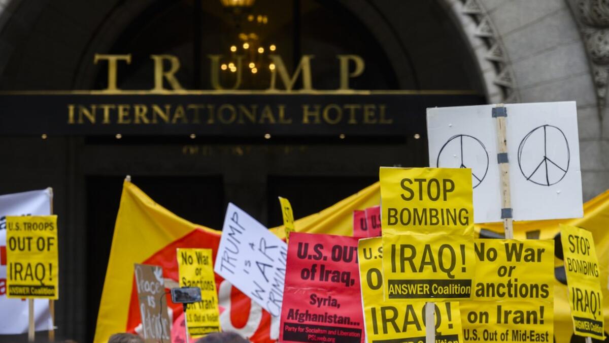 Anti-war activist demonstrate outside the Trump International Hotel in Washington, DC, on January 4, 2020. Demonstrators are protesting the US drone attack which killed Iran's Major General Qasem Soleimani in Iraq on January 3, a dramatic escalation in spiralling tensions between Iran and the US, which pledged to send thousands more troops to the region. ANDREW CABALLERO-REYNOLDS / AFP