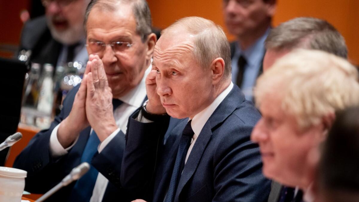 Acting Russian Foreign Minister Sergei Lavrov (L)sits next to Russian President Vladimir Putin at the start of a Peace summit on Libya at the Chancellery in Berlin, on January 19, 2020. World leaders gather in Berlin on January 19, 2020 to make a fresh push for peace in Libya, in a desperate bid to stop the conflict-wracked nation from turning into a "second Syria". AFP
