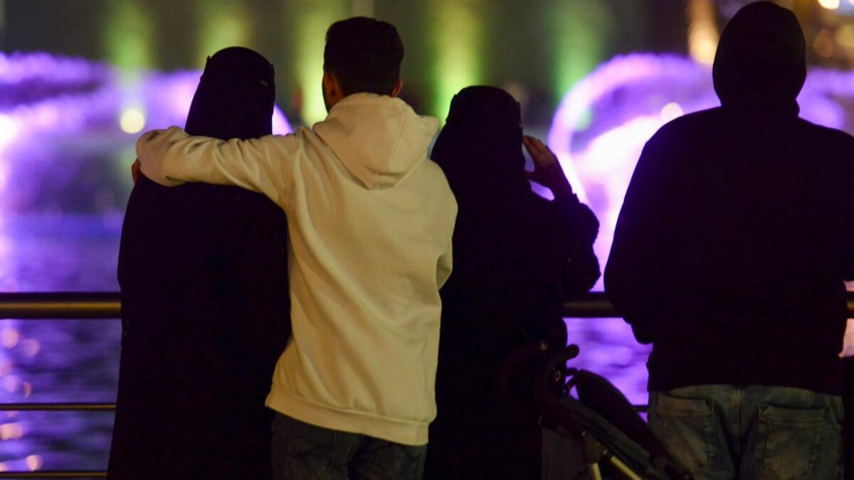 A picture taken on January 31, 2020 shows young Saudis gathering at the Riyadh Season Boulevard in the Saudi capital. In Saudi Arabia's rigid past, religious police once swooped down on rose sellers and anyone peddling red paraphernalia around Valentine's Day, but now a more open -- albeit risky -- dating culture is taking root. Pursuing relationships outside of marriage in the conservative Islamic kingdom once amounted to a death wish, and would-be Romeos resorted to pressing phone numbers up against their