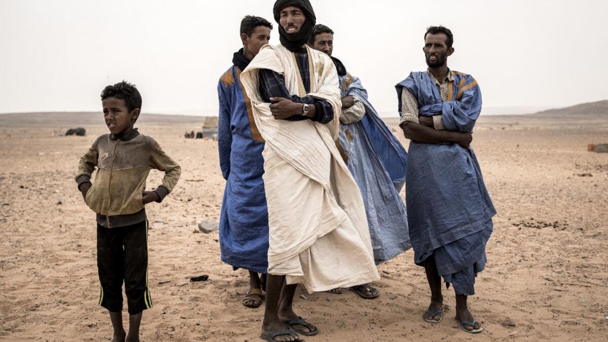 Young men from the small Nemadi(hunters) tribe in Eastern Mauritania are seen in the Loudeyatt Nemadi Camp on January 23, 2020. In the arid West African country of Mauritania, the way of life of the traditional group of hunters known as the Nemadi is slowly disappearing. JOHN WESSELS / AFP