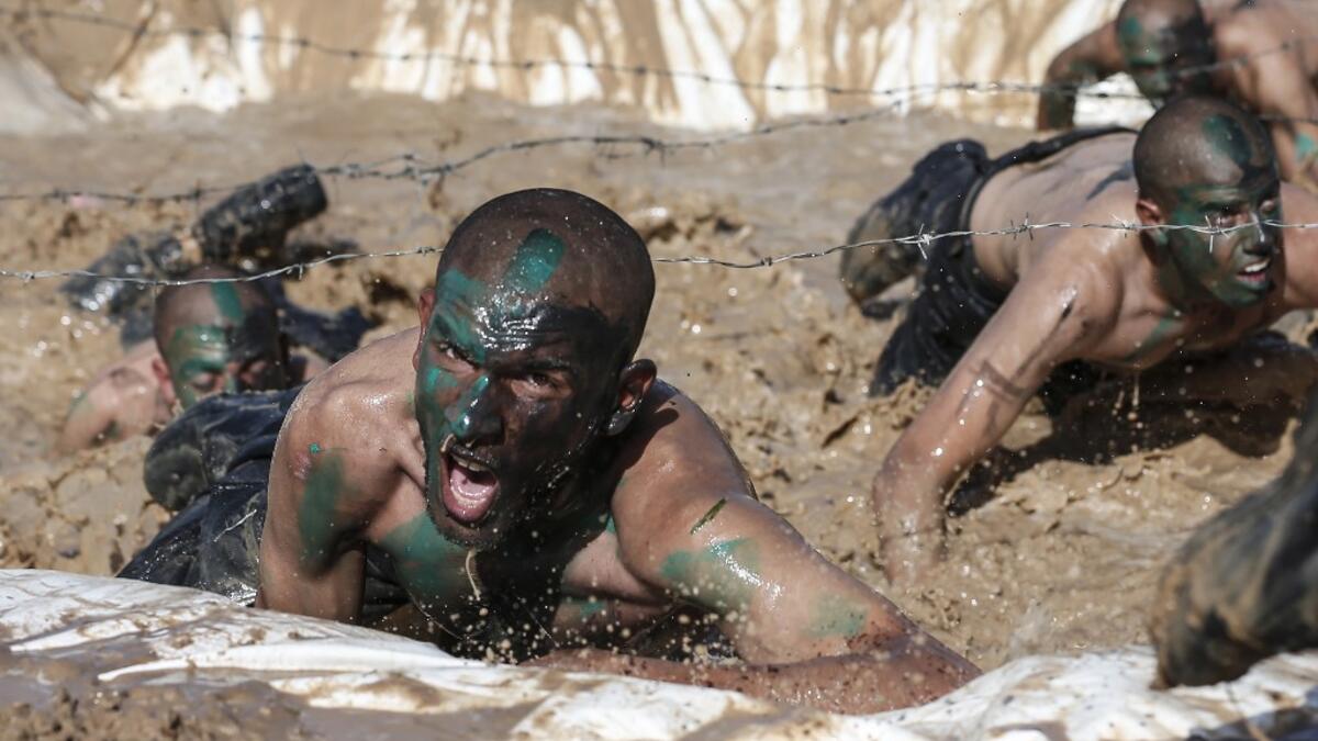 Palestinian police cadets take part in a training session at a police academy in Khan Yunis, in the southern Gaza Strip on February 6, 2020. MAHMUD HAMS / AFP
