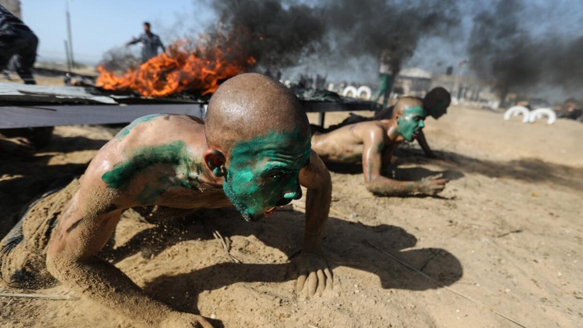 Palestinian police cadets take part in a training session at a police academy in Khan Yunis, in the southern Gaza Strip on February 6, 2020. MAHMUD HAMS / AFP
