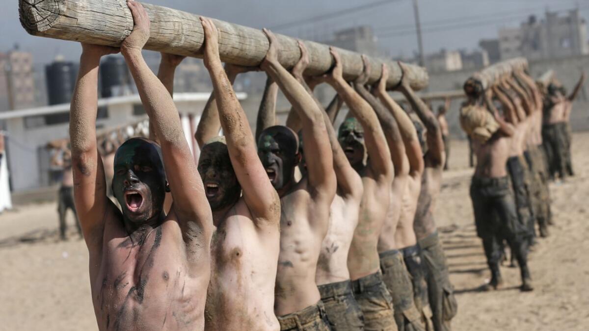 Palestinian police cadets take part in a training session at a police academy in Khan Yunis, in the southern Gaza Strip on February 6, 2020. MAHMUD HAMS / AFP