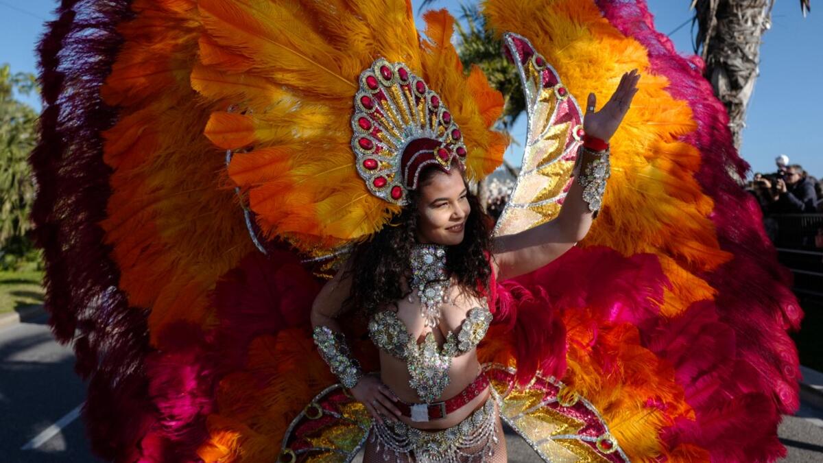 A participant in fancy dress takes part in the 136th Nice Carnival parade which celebrates this year the 'Fashion King' in Nice, southeastern France, on February 15, 2020. The carnival runs from February 15 to February 29, 2020. VALERY HACHE / AFP