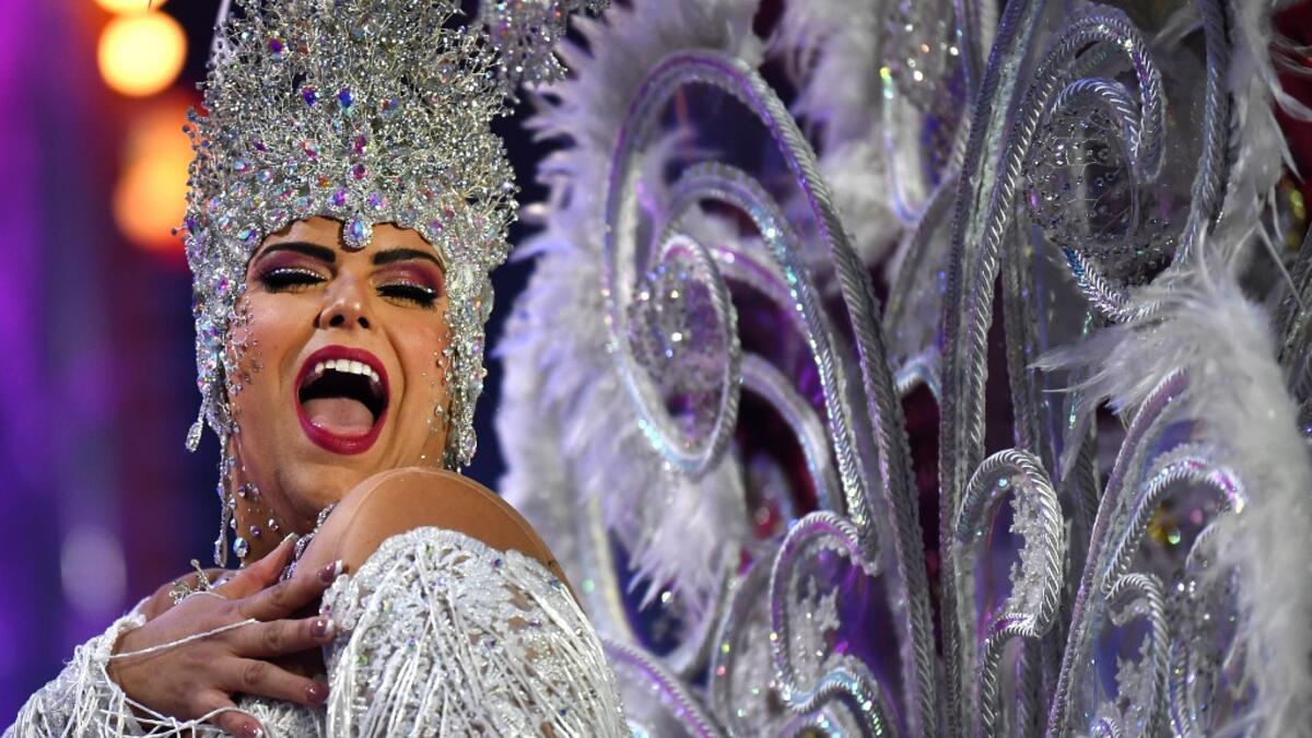 A participant presents her outfit during the Queen of the Carnival pageant contest in Santa Cruz de Tenerife, on the Spanish Canary island of Tenerife, on February 19, 2020. Gabriel BOUYS / AFP