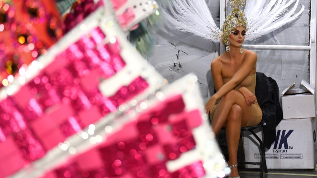 A participant waits backstage before presenting her outfit during the Queen of the Carnival pageant contest in Santa Cruz de Tenerife, on the Spanish Canary island of Tenerife, on February 19, 2020. Gabriel BOUYS / AFP