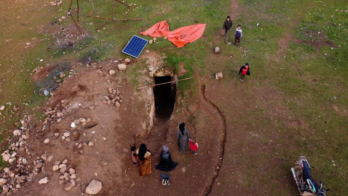 This picture taken on February 23, 2020 shows an aerial view of a solar panel placed outside the entrance of an underground shelter where several families of internally displaced Syrians from Aleppo and Idlib provinces are taking refuge, in the village of Taltunah about 15 kilometres northwest of Idlib in the northwestern Idlib province. Aref TAMMAWI / AFP
