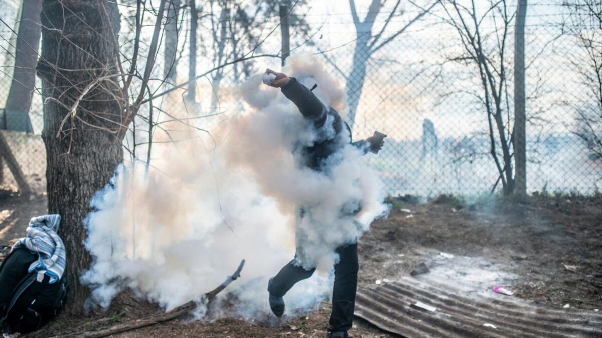 Greek police fired tear gas at migrants who have amassed at a border crossing in the western Turkish province of Edirne, some of whom responded by hurling stones at the officers. The clashes come as Greece bolsters its border after Ankara said it would no longer prevent refugees from crossing into Europe following the death of 33 Turkish troops in northern Syria. BULENT KILIC / AFP