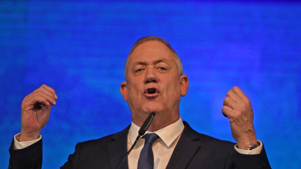 Benny Gantz, leader of the Blue and White (Kahol Lavan) electoral alliance, addresses supporters at their headquarters in the coastal city of Tel Aviv early on March 3, 2020, after polls officially closed. GALI TIBBON / AFP