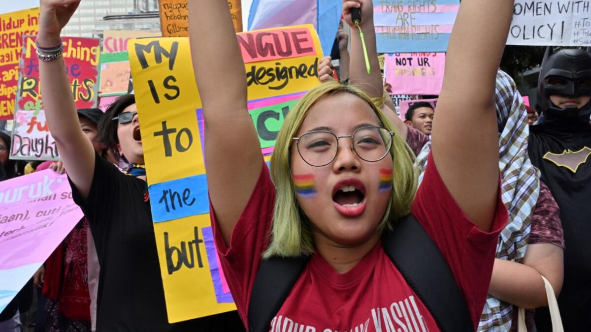 Indonesian people march to mark the International Women’s Day in Jakarta on March 8, 2020. ADEK BERRY / AFP