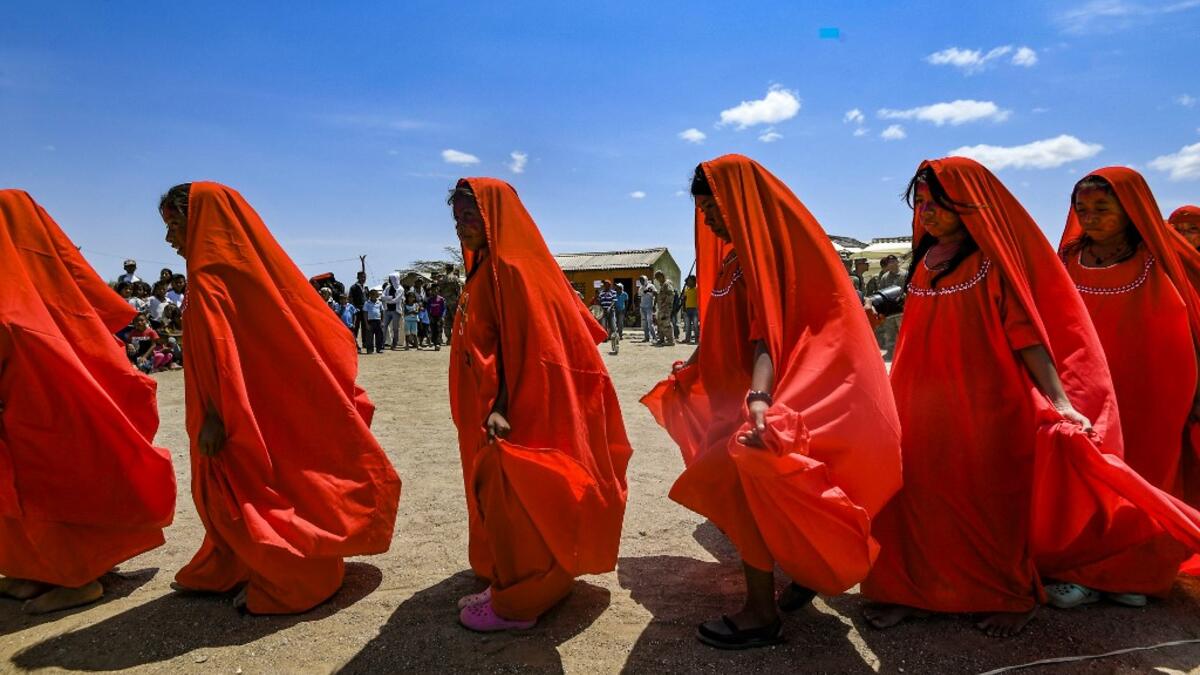 Wayuu girls perform the traditional La Yonna dance, in Tres Bocas, northern Colombia, on March 13, 2020. Juan BARRETO / AFP