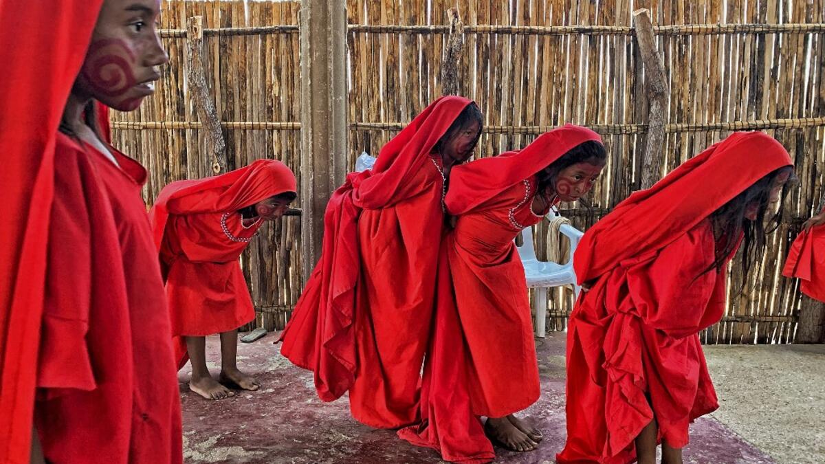Wayuu girls perform the traditional La Yonna dance, in Tres Bocas, northern Colombia, on March 13, 2020. Juan BARRETO / AFP
