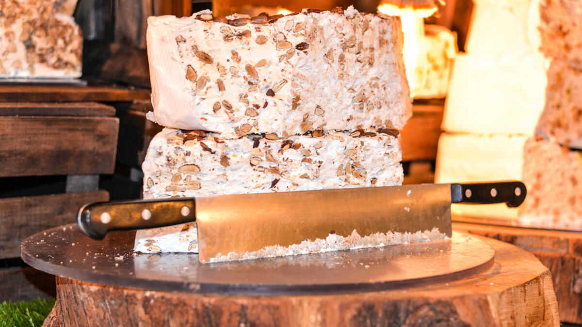 Home made artisan assorted nougat in different flavors. Delicious traditional festive torrone o nougat with nuts, pistachios or almonds (Shutterstock)