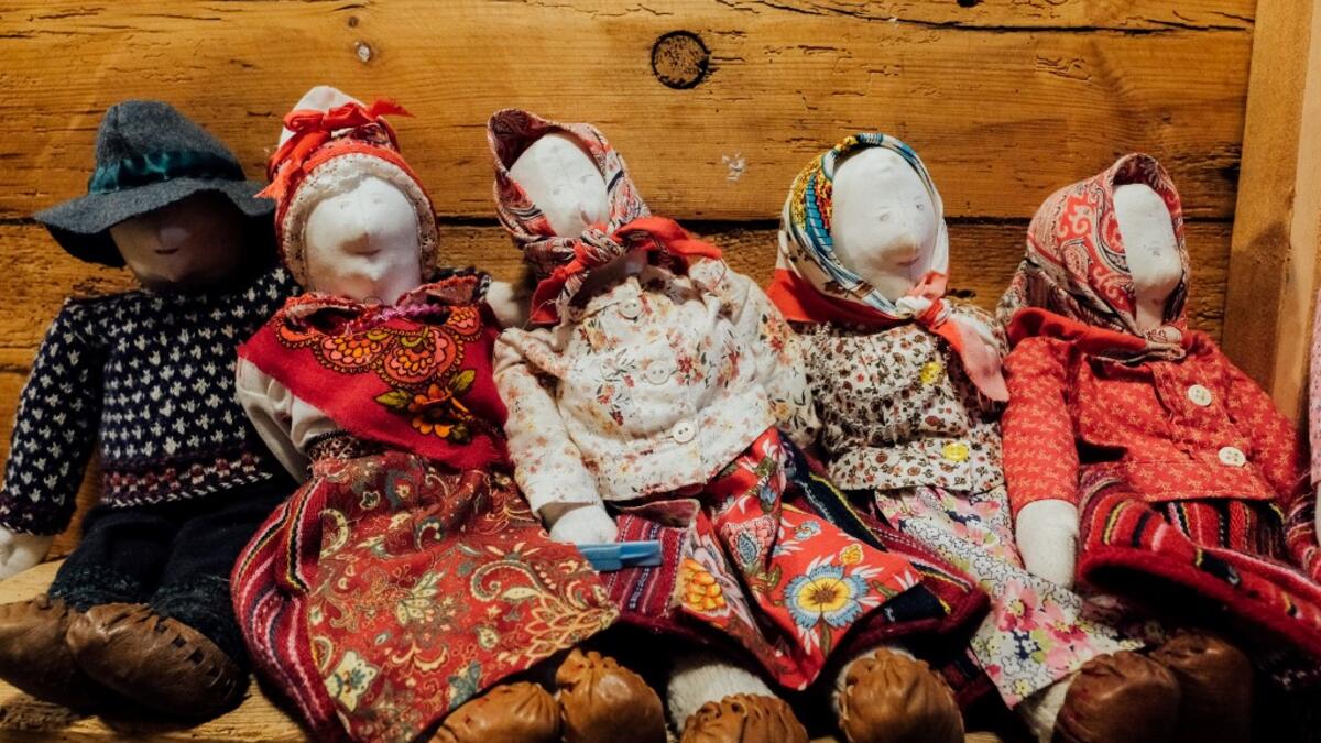 A picture taken on November 20, 2019 shows traditional dolls at the cultural centre on Kihnu island in the Baltic Sea, 10 kilometres (six miles) off the coast of Estonia. Steeped in folk traditions, Kihnu's historic way of life however is now threatened as economic hardship drives more and more islanders away in search of work. Alessandro RAMPAZZO / AFP