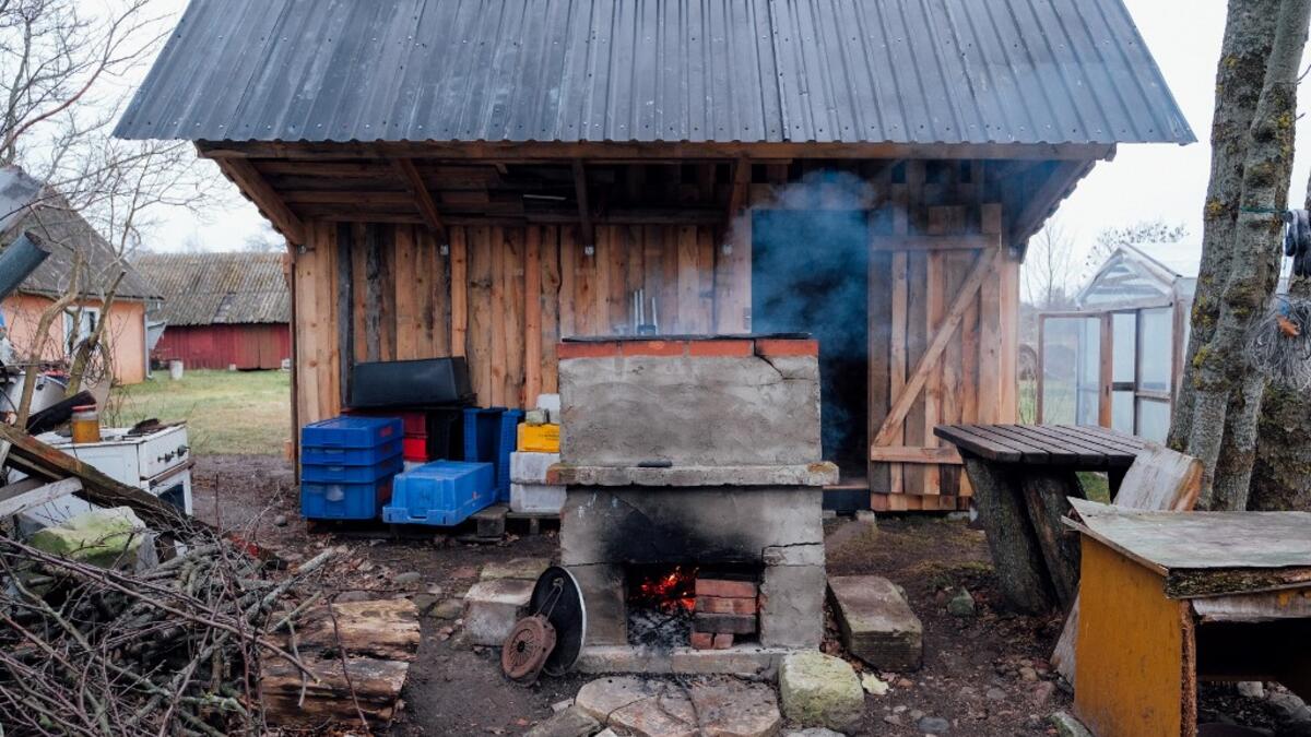 A picture taken on November 20, 2019 shows a barn on Kihnu island in the Baltic Sea, 10 kilometres (six miles) off the coast of Estonia. Steeped in folk traditions, Kihnu's historic way of life however is now threatened as economic hardship drives more and more islanders away in search of work. Alessandro RAMPAZZO / AFP