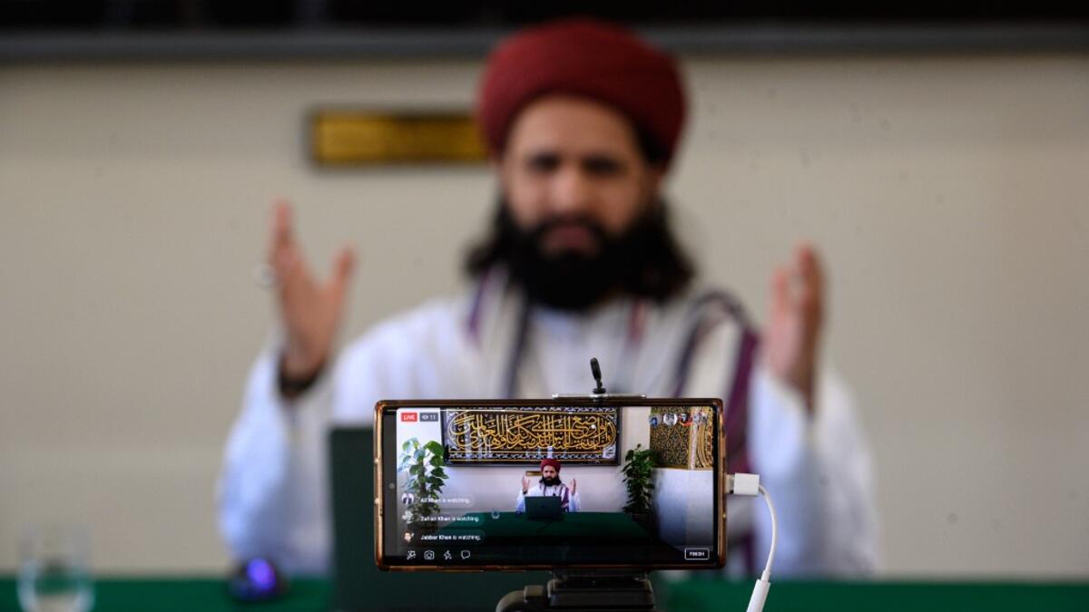 Imam Hassanat Ahmed delivers his Friday broadcast entitled 'Preparing for a Unique Ramadan' via multiple social media platforms from the otherwise empty Noor Ul Islam Mosque on the day before Ramadan commences in the UK, in Bury, Greater Manchester on April 24, 2020. The mosque, like all religious venues, has been closed to worshipers during the national lockdown due to the novel coronavirus COVID-19 pandemic. OLI SCARFF / AFP