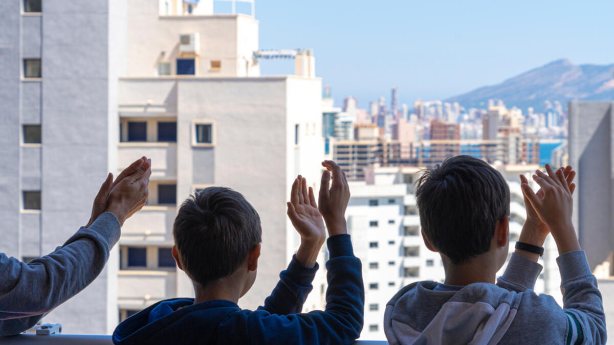 It could be that people feel trapped in their houses and apartments... But it could also be that they are finally singing together again, helping each other and experiencing a sense of community again for a long time. (Shutterstock/ File Photo)