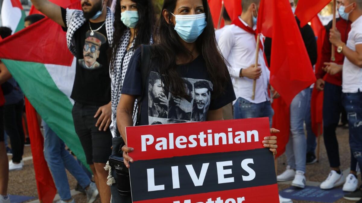 Protesters gather in Tel Aviv's Rabin Square on June 6, 2020, to denounce Israel's plan to annex parts of the occupied West Bank. Israeli Prime Minister Benjamin Netanyahu has vowed to forge ahead with annexing settlements and the Jordan Valley, in line with the peace proposals unveiled in January by US President Donald Trump. The plan has been angrily rejected by the Palestinians, who say they were not consulted on proposals they see as capitulating to Israeli demands. JACK GUEZ / AFP