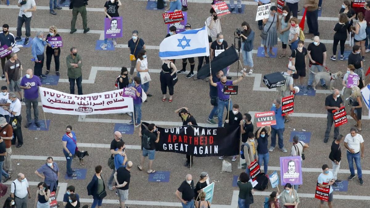 Protesters gather in Tel Aviv's Rabin Square on June 6, 2020, to denounce Israel's plan to annex parts of the occupied West Bank. Israeli Prime Minister Benjamin Netanyahu has vowed to forge ahead with annexing settlements and the Jordan Valley, in line with the peace proposals unveiled in January by US President Donald Trump. The plan has been angrily rejected by the Palestinians, who say they were not consulted on proposals they see as capitulating to Israeli demands. JACK GUEZ / AFP
