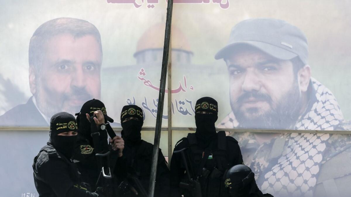 A member of the Palestinian Islamic Jihad group take part in a symbolic funeral for the movement's former leader Ramadan Shalah in Gaza city, on June 7, 2020, a day after he died in neighbouring Lebanon. The 62-year-old died in a Beirut hospital after a long illness, before his body was transported to neighbouring Syria, a Palestinian source said. MAHMUD HAMS / AFP