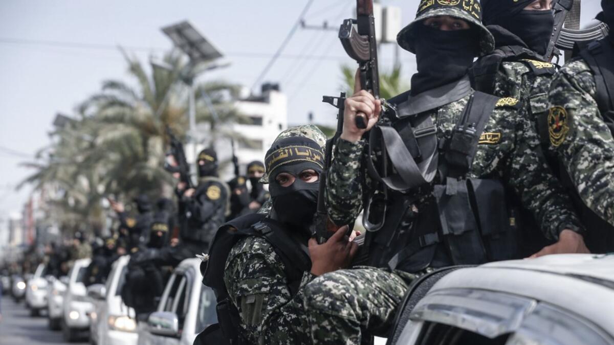 Members of the Palestinian Islamic Jihad militant take part in a symbolic funeral for the movement's former leader Ramadan Shalah in Gaza city, on June 7, 2020, a day after he died in neighbouring Lebanon. The 62-year-old died in a Beirut hospital after a long illness, before his body was transported to neighbouring Syria, a Palestinian source said. MAHMUD HAMS / AFP