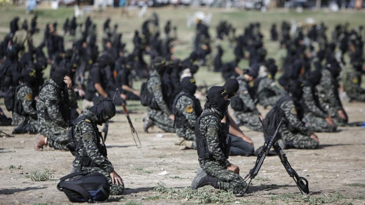 Members of the Palestinian Islamic Jihad group pray ahead of a military parade during a condolence ceremony for the movement's former leader Ramadan Shalah in Gaza city, on June 8, 2020, two days after his death in neighbouring Lebanon. The 62-year-old was buried in Syria on June 7, a day following his death after a long illness. Mohammed ABED / AFP