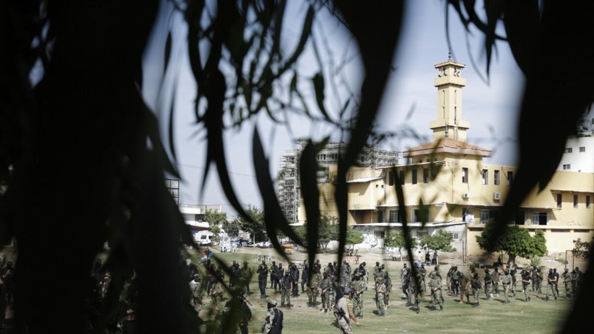 Members of the Palestinian Islamic Jihad group take part in a military parade during a condolences ceremony for the movement's former leader Ramadan Shalah in Gaza city, on June 8, 2020, two days after his death in neighbouring Lebanon. The 62-year-old was buried in Syria on June 7, a day following his death after a long illness. Mohammed ABED / AFP