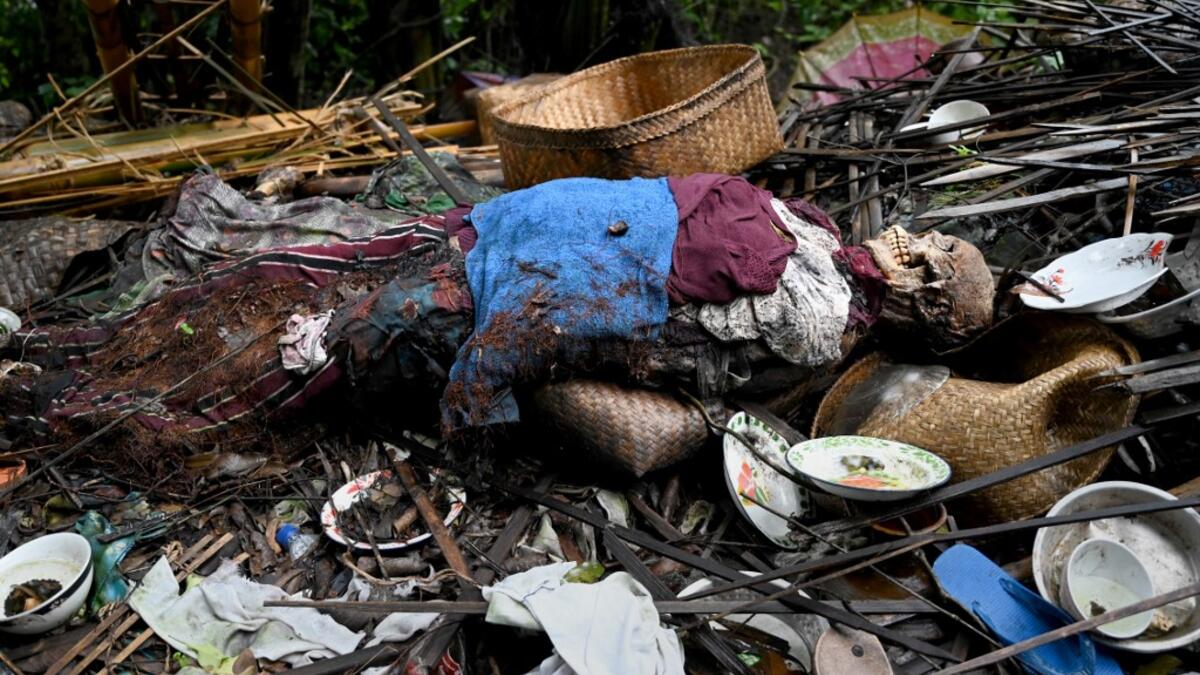 This picture taken on February 20, 2020 shows the body of a deceased at a cemetery where Bali's Trunyanese people hold open-air burials - before restrictions were implemented due to the COVID-19 coronavirus - near the village of Trunyan in Bangli Regency, near Lake Batur on Bali island. For centuries Bali's Trunyanese people have left their dead to decompose in the open air, the bodies placed in bamboo cages until only the skeletons remain -- a ritual they haven't given up -- even as the COVID-19 pandemic u