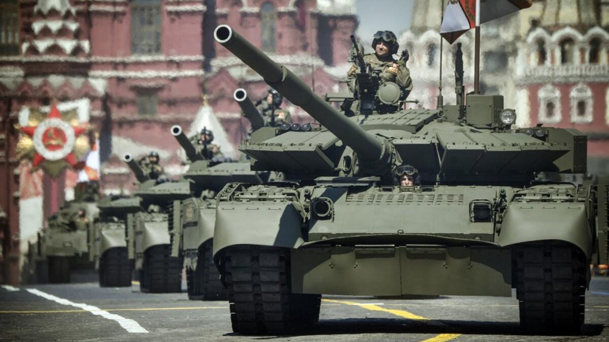Russian T-72B3 tanks move through Red Square during a military parade, which marks the 75th anniversary of the Soviet victory over Nazi Germany in World War Two, in Moscow on June 24, 2020. The parade, usually held on May 9, was postponed this year because of the coronavirus pandemic. Alexander NEMENOV / AFP
