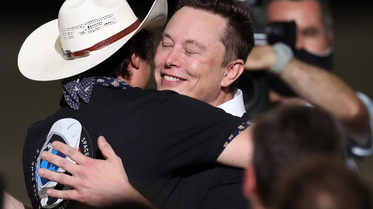 Spacex founder Elon Musk celebrates after the successful launch of the SpaceX Falcon 9 rocket with the manned Crew Dragon spacecraft at the Kennedy Space Center on May 30, 2020 in Cape Canaveral, Florida. Earlier in the day NASA astronauts Bob Behnken and Doug Hurley lifted off an inaugural flight and will be the first people since the end of the Space Shuttle program in 2011 to be launched into space from the United States. Joe Raedle/Getty Images/AFP