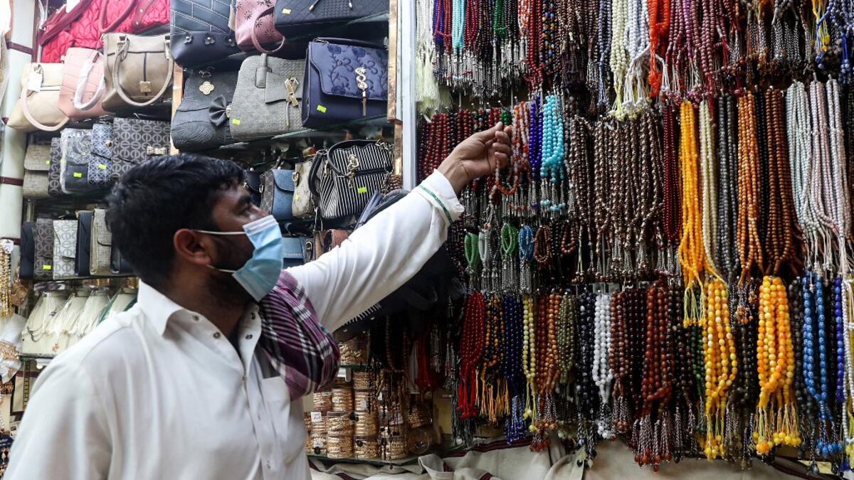 A man checks prayers beads in the holy city of Mecca on June 27, 2020. This year's hajj, which has been scaled back dramatically to include only around 1,000 Muslim pilgrims as Saudi Arabia battles a coronavirus surge, will begin on July 29, authorities said. Some 2.5 million people from all over the world usually participate in the ritual that takes place over several days, centered on the holy city of Mecca.  AFP
