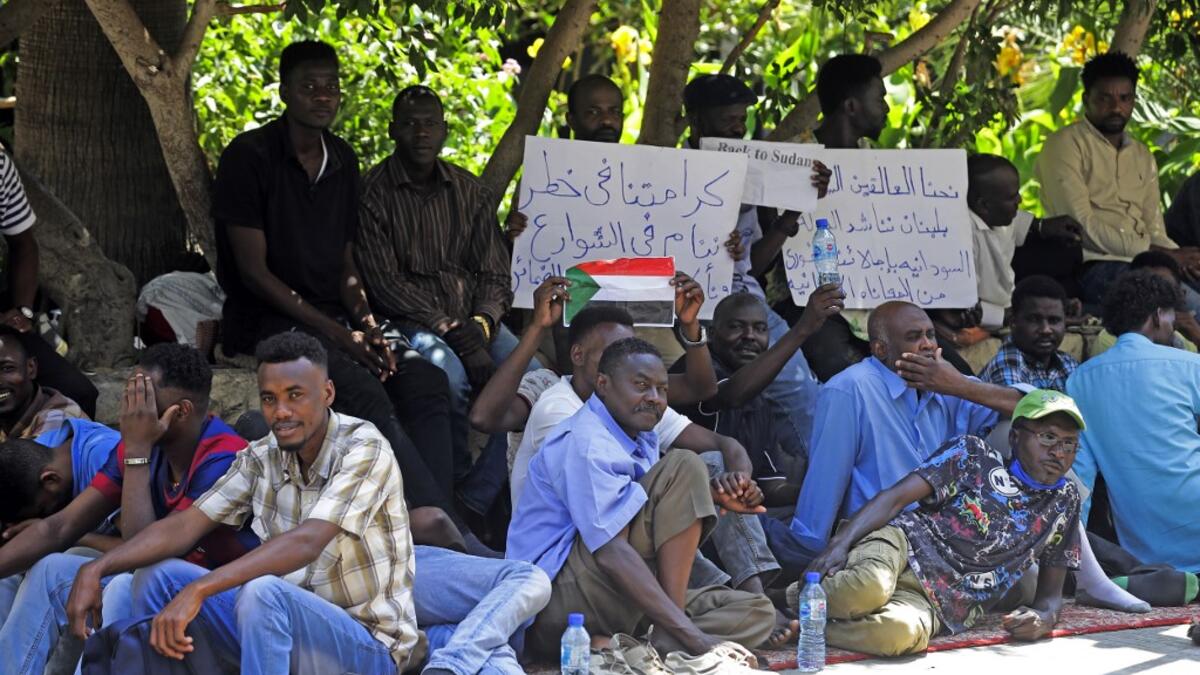 Sudanese workers, who lost their jobs due to the deteriorating economic situation in Lebanon, protest outside their county's embassy in Beirut to demand repatriation, on July 2, 2020. JOSEPH EID / AFP