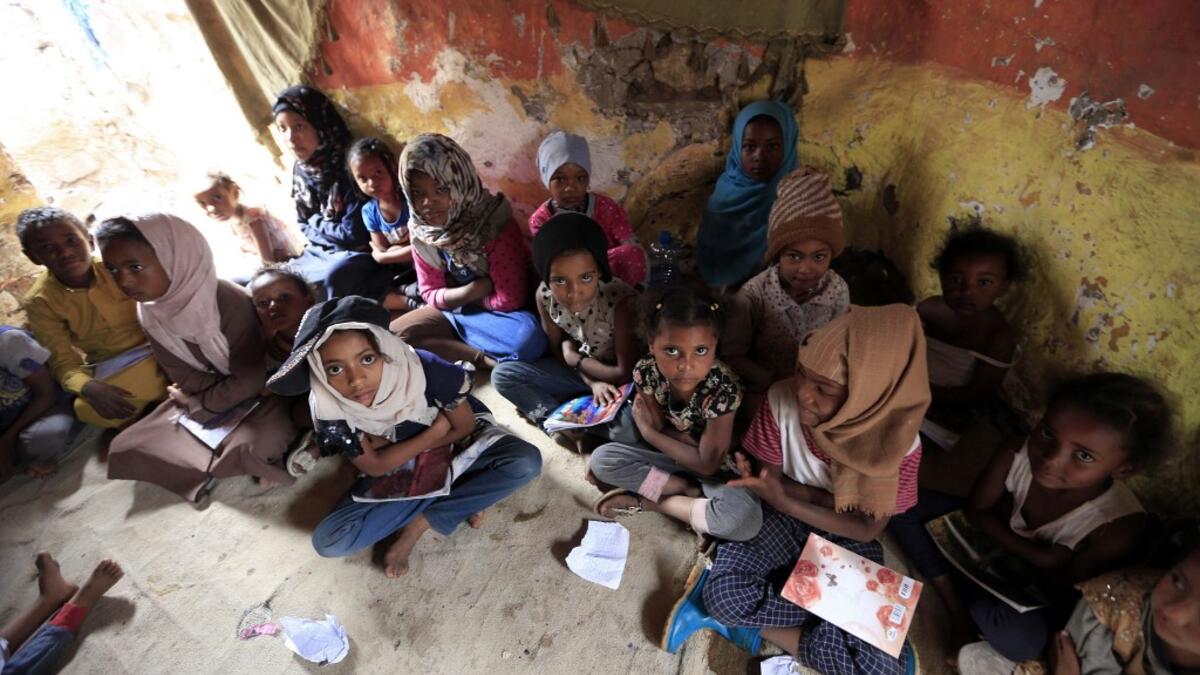 Children of Yemen's minority group known as "Muhamasheen" -- literally the "Marginalised" attend a lesson at a slum in the capital Sanaa on July 4, 2020. At a time when the Black Lives Matter movement is reshaping societies, black Yemenis have scant hope for an end to centuries of discrimination that has only worsened during the civil war. In Sanaa, members of the minority group known as "Muhamasheen" live in dismal conditions in densely populated slums. They count among the poorest of the poor in the Arab