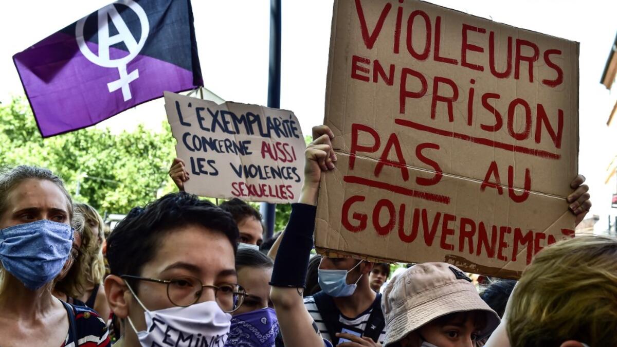 People gathered to protest against France's new Interior Minister Gerald Darmanin, aged 37, whose promotion has outraged feminists because of a years-old rape claim that remains under investigation, and against France's new Justice Minister Eric Dupond-Moretti, who aroused the ire of feminists by criticising the #MeToo movement against sexual harassment, saying such complaints "should be made not to the media, not on social networks, but to the judiciary." GEORGES GOBET / AFP