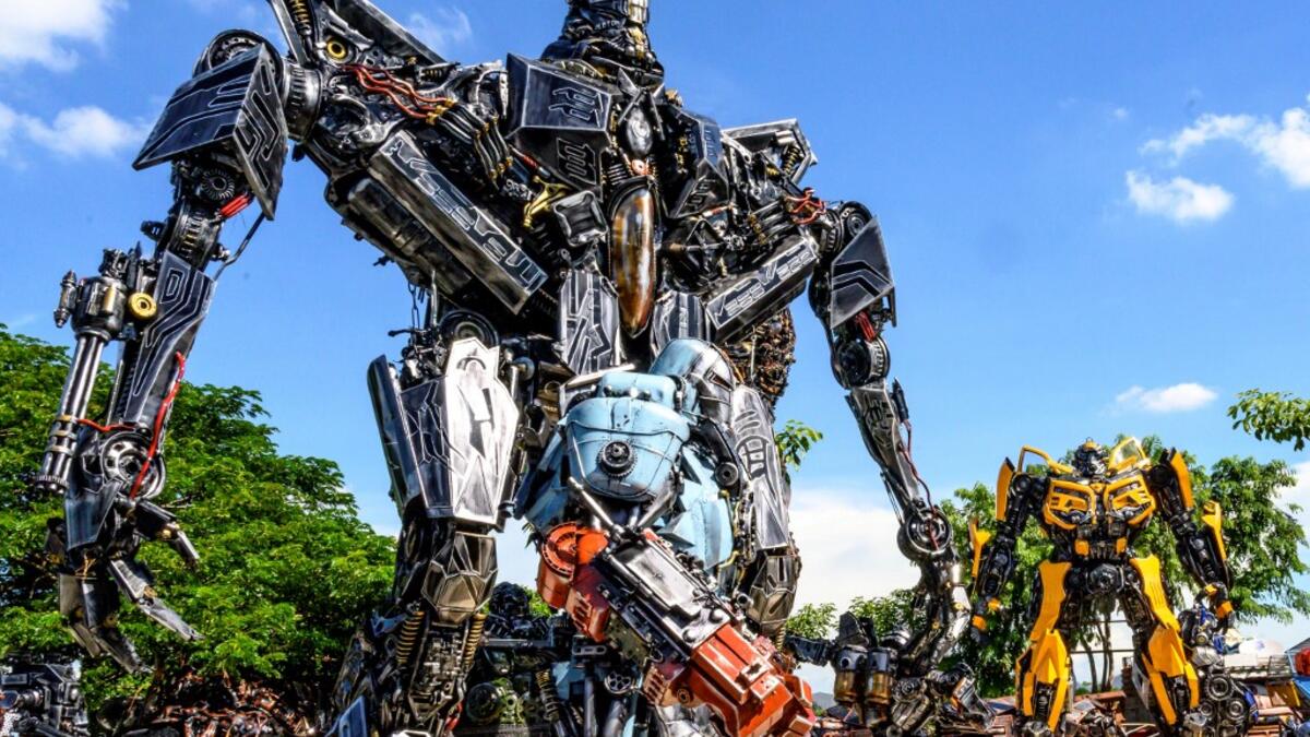 This photograph taken on July 18, 2020 shows life-sized sculptures of characters from the "Transformers" film franchise made of scrap metal parts at the Ban Hun Lek museum in Ang Thong, some 100km north of Bangkok. "Ban Hun Lek" or "The House of Steel Robots" is a museum where a collective of artists display their scrap metal creations depicting popular comics and sci-fi film characters. Mladen ANTONOV / AFP