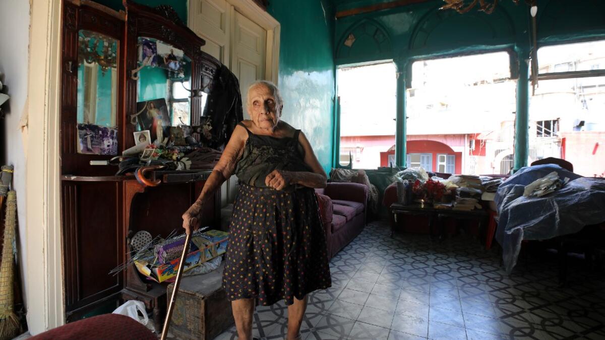 Rose Ghoulam, 90-years-old, stands in her damaged house in the damaged neighbourhood Gemmayze in the Lebanese capital Beirut on August 6, 2020, two days after a massive explosion shook the Lebanese capital. The blast, which appeared to have been caused by a fire igniting 2,750 tonnes of ammonium nitrate left unsecured in a warehouse, was felt as far away as Cyprus, some 150 miles (240 kilometres) to the northwest. The scale of the destruction was such that the Lebanese capital resembled the scene of an eart