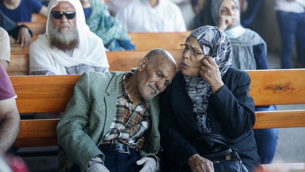 Palestinians wait to cross to the Egyptian side of Rafah border crossing after months of closure due to the coronavirus pandemic in the southern Gaza Strip, on August 11, 2020. SAID KHATIB / AFP