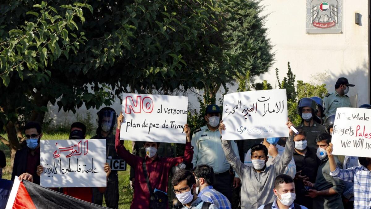 Iranian students hold banners during a protest against a US-brokered deal between Israel and the UAE to normalise relations, in front of the UAE embassy in the capital Tehran, on August 15 2020. AFP