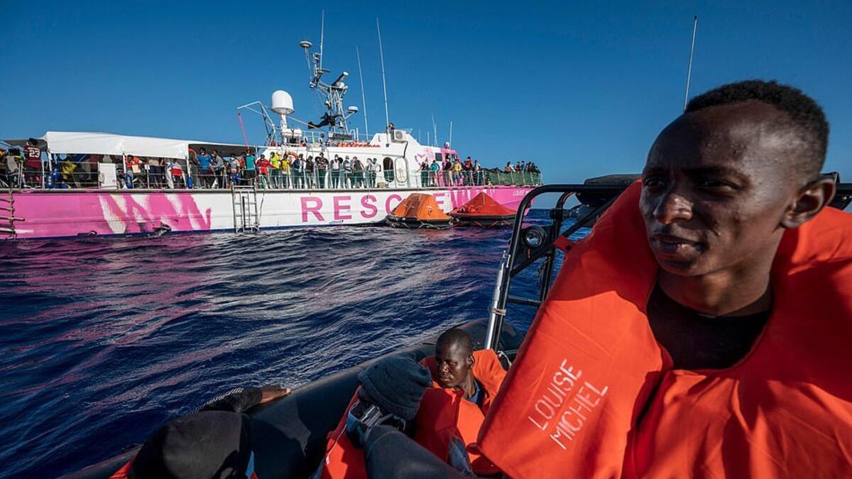 The 100ft former French navy vessel, named after a female anarchist, had been almost double its maximum safe capacity of 120 and was said to be 'losing its balance' (AFP)