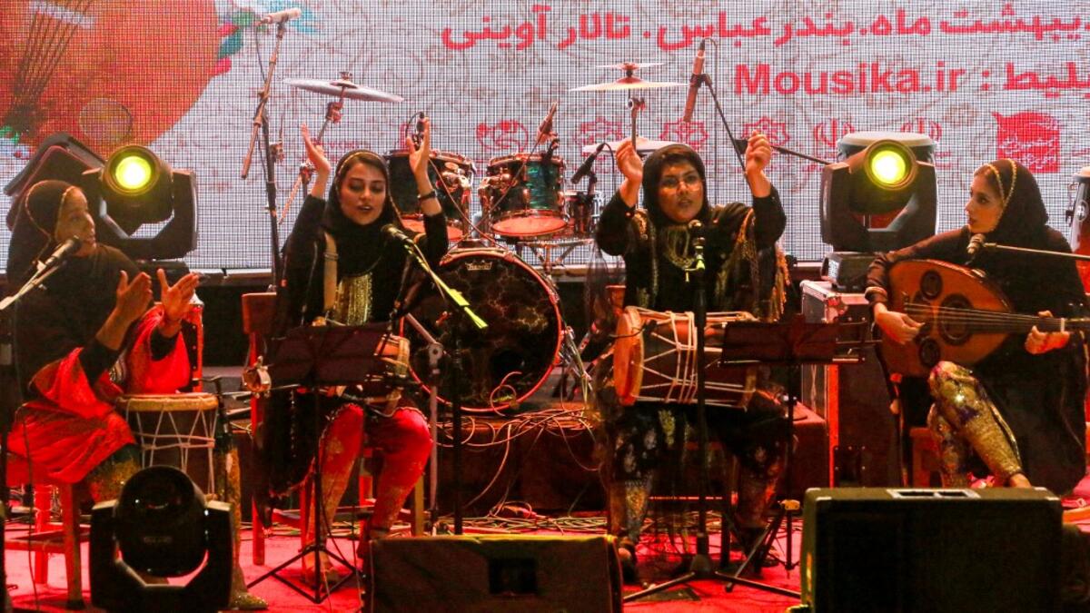 Members of the Iranian all-women music band "Dingo" (L to R) Malihe Shahinzadeh, Negin Heydari, Faezeh Mohseni, and Noushin Yousefzadeh perform together at a concert during the state-organised "Persian Gulf music" festival at Avini Hall in Iran's southern Gulf port city of Bandar Abbas on April 29, 2019. ATTA KENARE / AFP