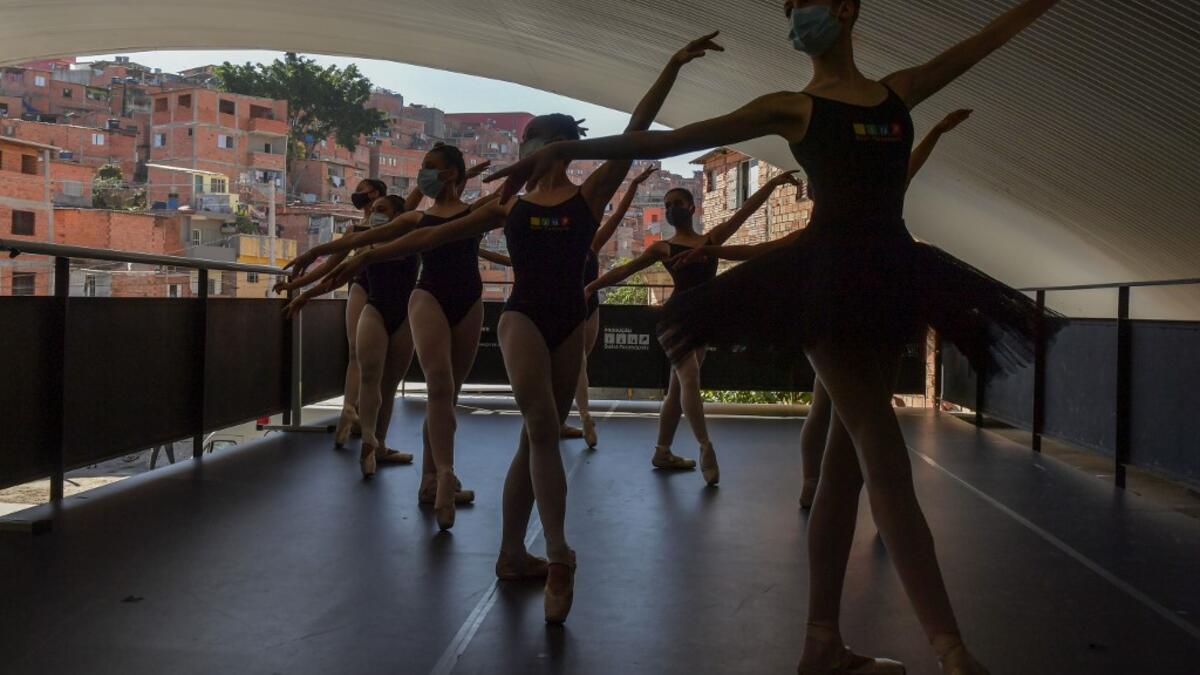 e 200 ballet students of Paraisopolis, the second largest favela in Sao Paulo, restarted rehearsals after five months with a coreography about a police operation that put their community in mourning last year. NELSON ALMEIDA / AFP