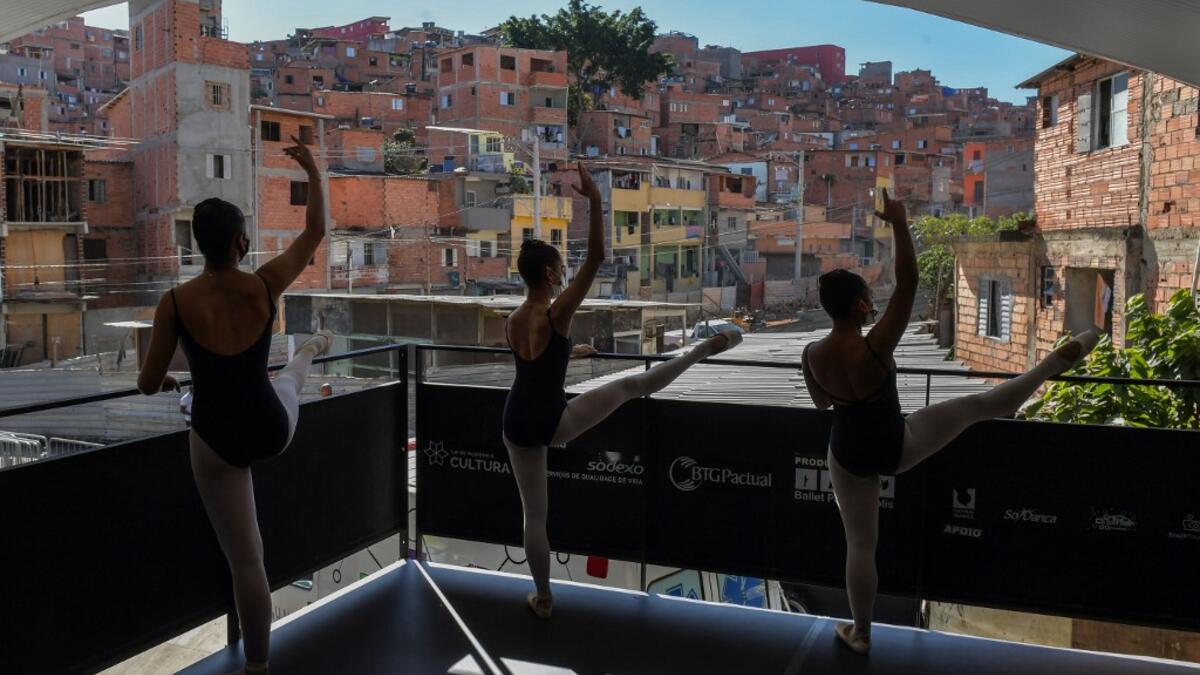 The 200 ballet students of Paraisopolis, the second largest favela in Sao Paulo, restarted rehearsals after five months with a coreography about a police operation that put their community in mourning last year. NELSON ALMEIDA / AFP