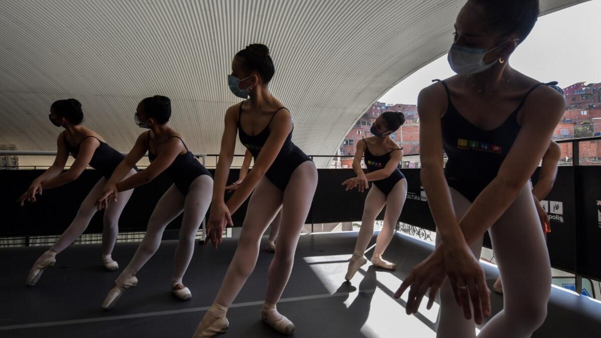 Ballet Paraisopolis students rehearse in Paraisopolis favela, outskirts of Sao Paulo, Brazil on August 27, 2020, amid the new coronavirus COVID-19 pandemic. NELSON ALMEIDA / AFP